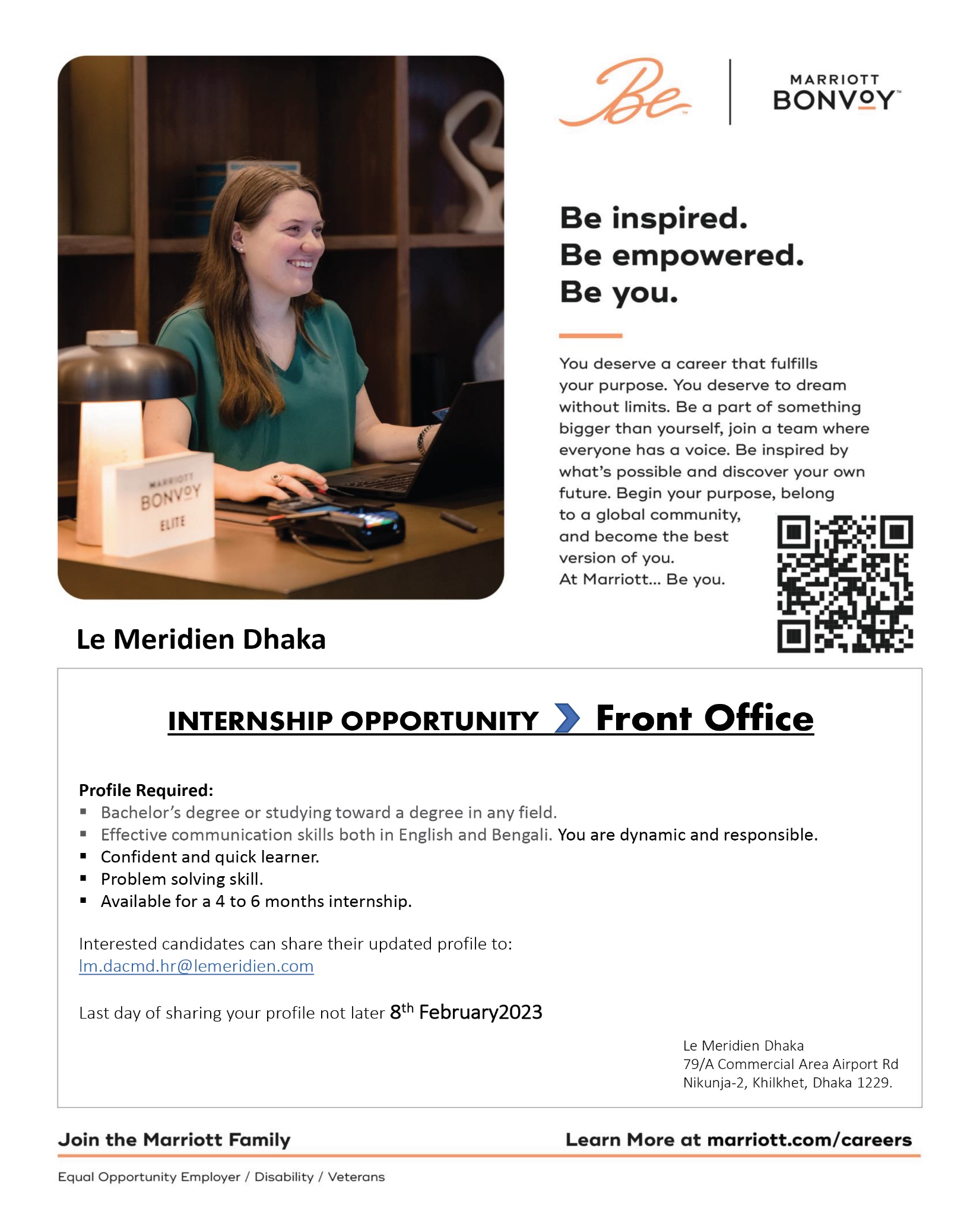 A person sitting at a desk with a computer
    
    Description automatically generated